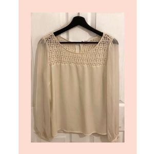Cream colored blouse with eyelet details